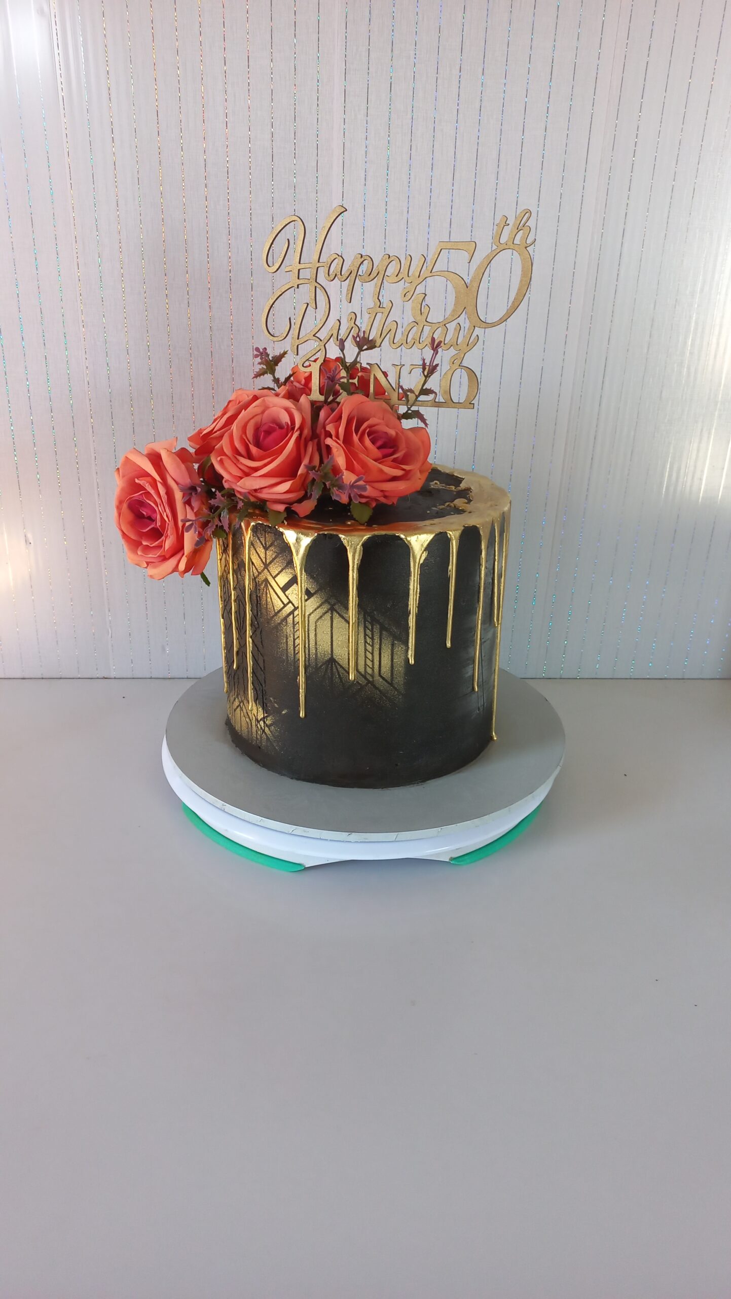 Black and gold drip cake
